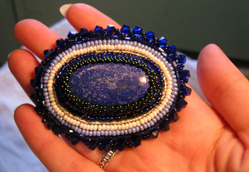 Choosing a brooch made of beads and beads